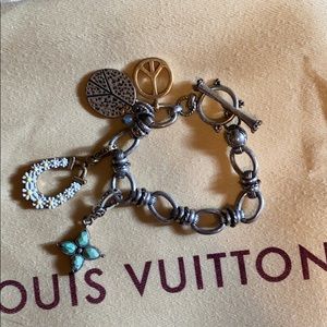 Lucky brand charm bracelet in silver color